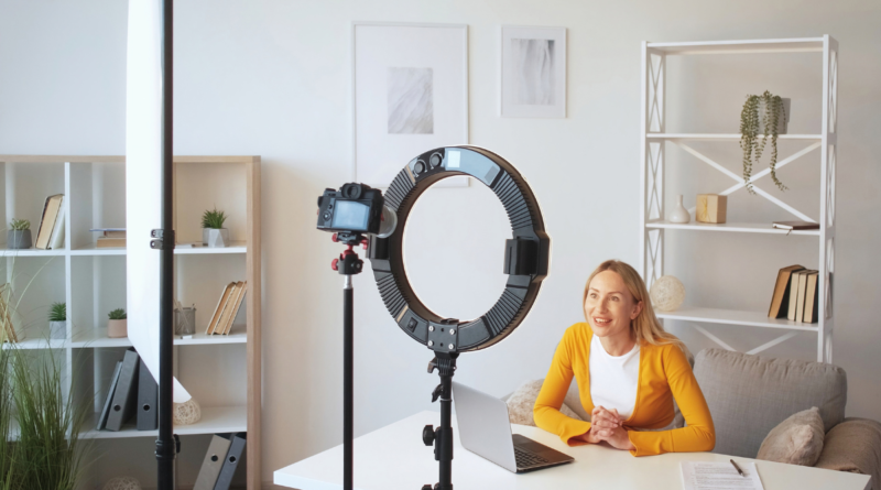 woman sitting at a table during a vlog session